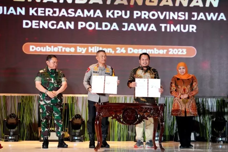 Gubernur Khofifah Saksikan Penandatanganan Perjanjian Kerja Sama KPU Jatim dan Polda Jatim 
